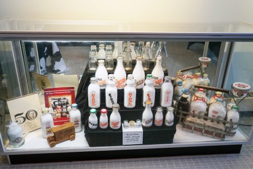 Vintage glass bottles at Byrne Dairy 90th anniversary exhibit at the MOST